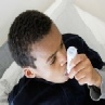 child-using-inhaler-to-control-asthma